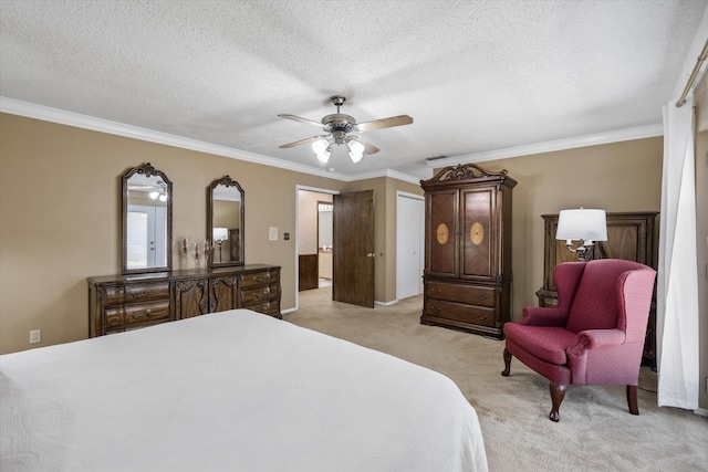 carpeted bedroom with a textured ceiling, ornamental molding, and ceiling fan