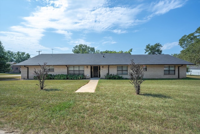 ranch-style home with a front lawn