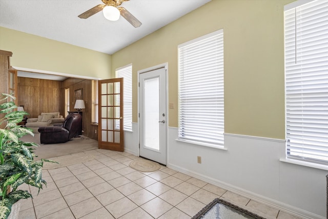 tiled entryway featuring a textured ceiling, ceiling fan, french doors, and plenty of natural light