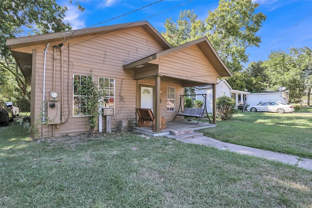 view of front facade with a porch and a front yard