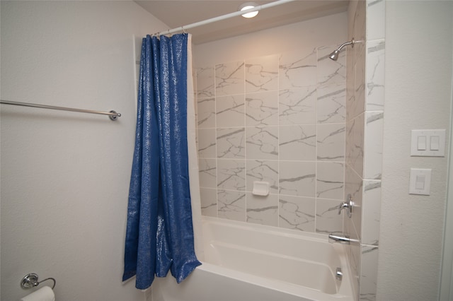 bathroom with shower / tub combo