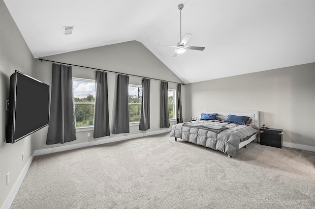 bedroom featuring multiple windows, carpet floors, ceiling fan, and lofted ceiling