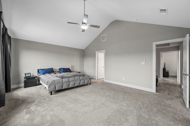 carpeted bedroom featuring ceiling fan and high vaulted ceiling