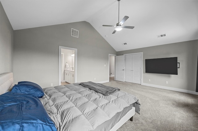 carpeted bedroom featuring ceiling fan, ensuite bath, high vaulted ceiling, and a closet