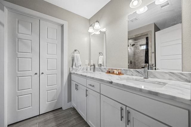 bathroom with vanity and an enclosed shower