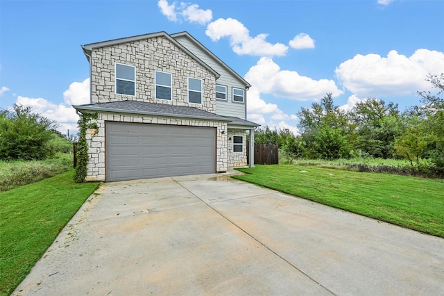 front facade featuring a front yard and a garage