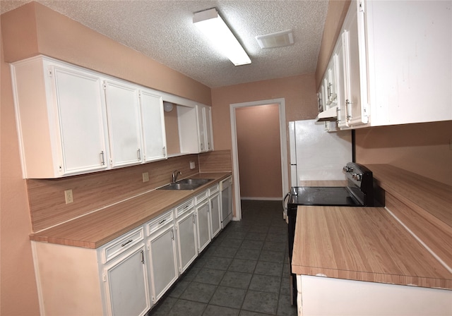 kitchen with a textured ceiling, black electric range oven, white cabinetry, and sink