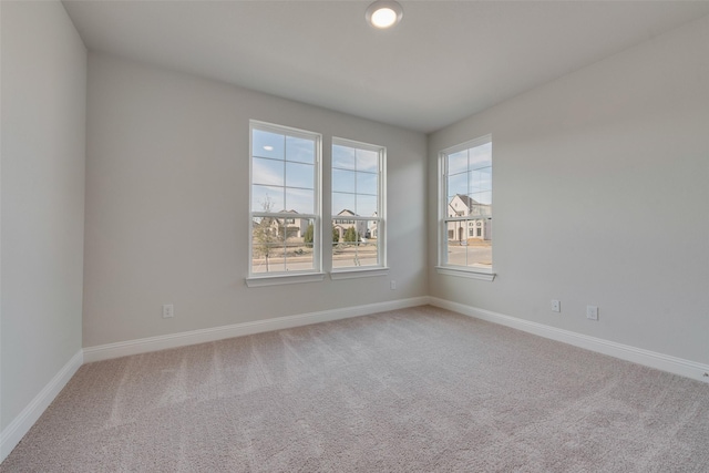 unfurnished room with carpet floors