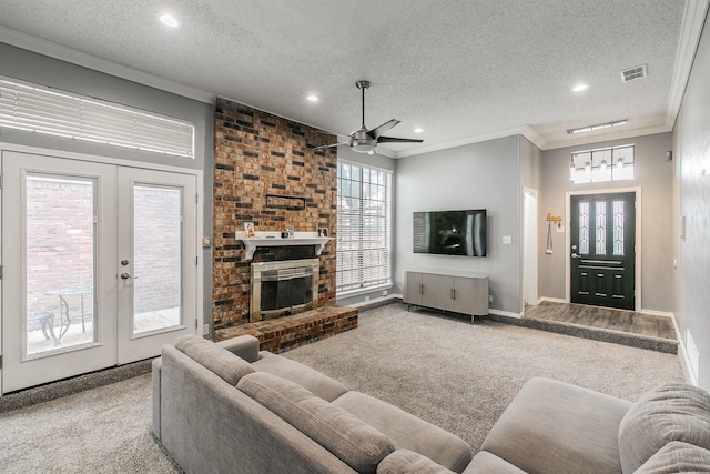 205 Benwynd Dr, Mesquite, TX 75149 - carpeted living room featuring ornamental molding, ceiling fan, recessed lighting, a textured ceiling, and french doors