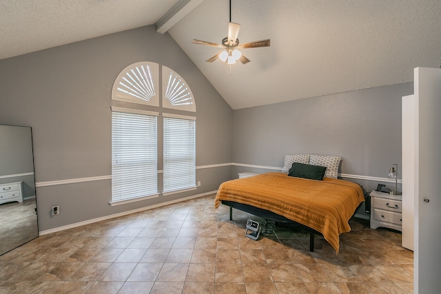 bedroom featuring a textured ceiling, vaulted ceiling with beams, multiple windows, and ceiling fan