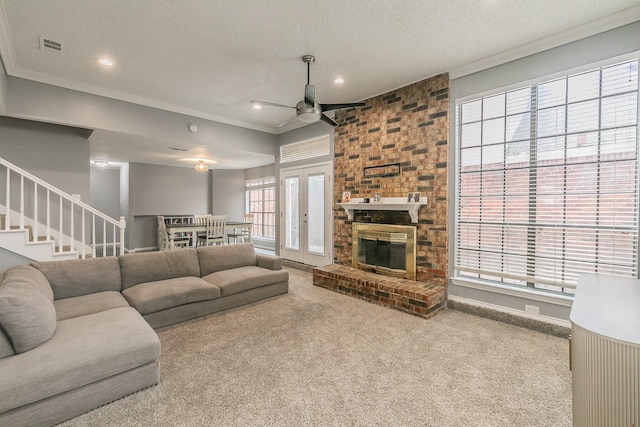 205 Benwynd Dr, Mesquite, TX 75149 - living room featuring a ceiling fan, carpet flooring, ornamental molding, a textured ceiling, and recessed lighting
