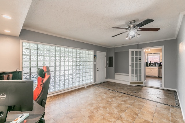 unfurnished office with ceiling fan, a textured ceiling, and crown molding