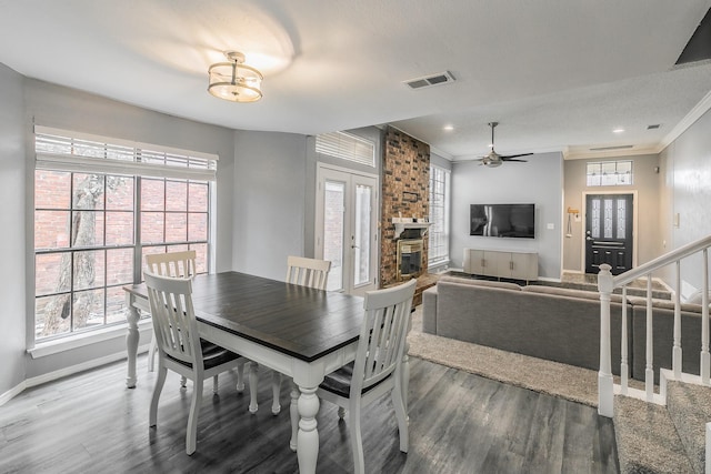 205 Benwynd Dr, Mesquite, TX 75149 - dining space with wood finished floors, ceiling fan, plenty of natural light, ornamental molding, and recessed lighting