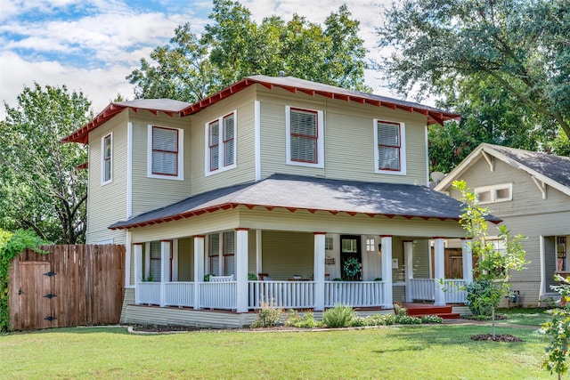 view of front of house featuring a front lawn and covered porch