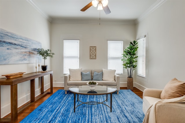 living room with ceiling fan, crown molding, and dark hardwood / wood-style flooring