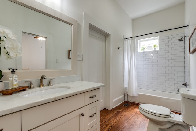 full bathroom featuring shower / bathtub combination with curtain, wood-type flooring, vanity, and toilet