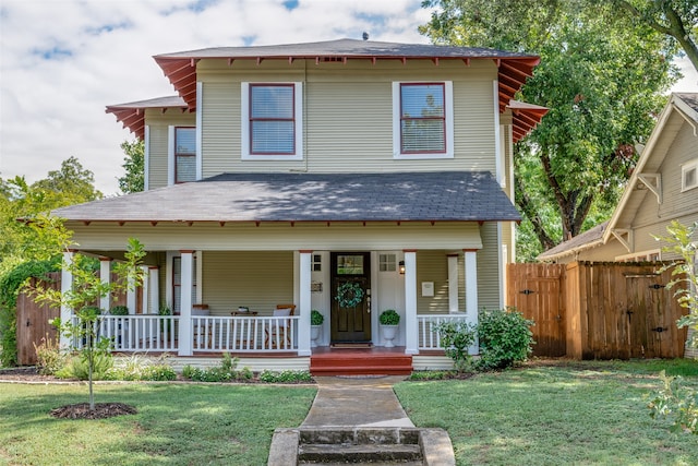 view of front of home featuring a front lawn and a porch