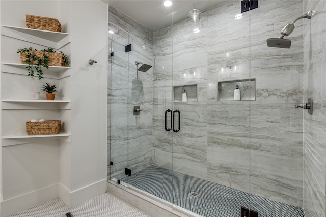 bathroom featuring tile patterned flooring and a shower with door