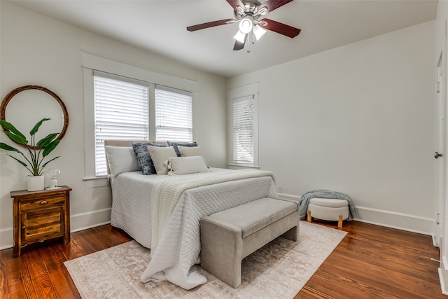 bedroom featuring ceiling fan and dark hardwood / wood-style flooring