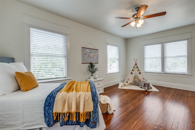 bedroom featuring dark wood-type flooring and ceiling fan