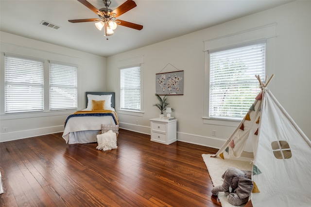 bedroom featuring ceiling fan and dark hardwood / wood-style floors