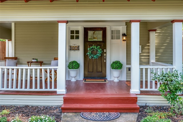 doorway to property with a porch