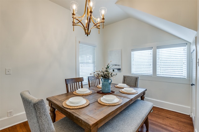 dining space featuring a chandelier, vaulted ceiling, and dark hardwood / wood-style floors