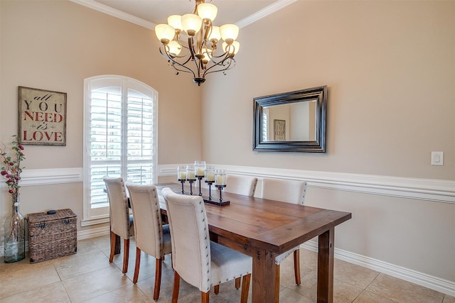 tiled dining space featuring a notable chandelier and crown molding