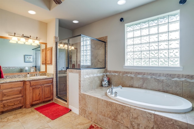 bathroom featuring vanity, plus walk in shower, and tile patterned floors