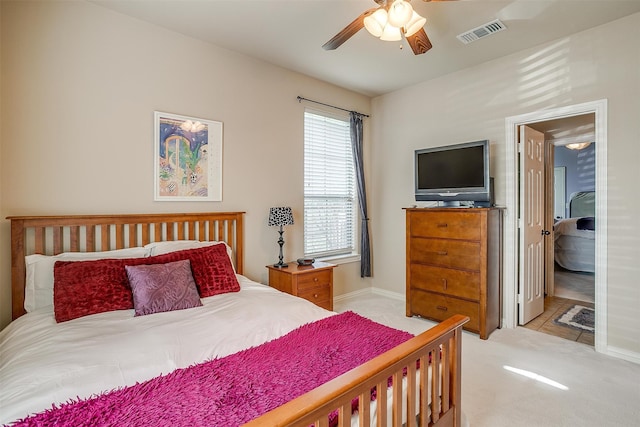 bedroom with light carpet and ceiling fan