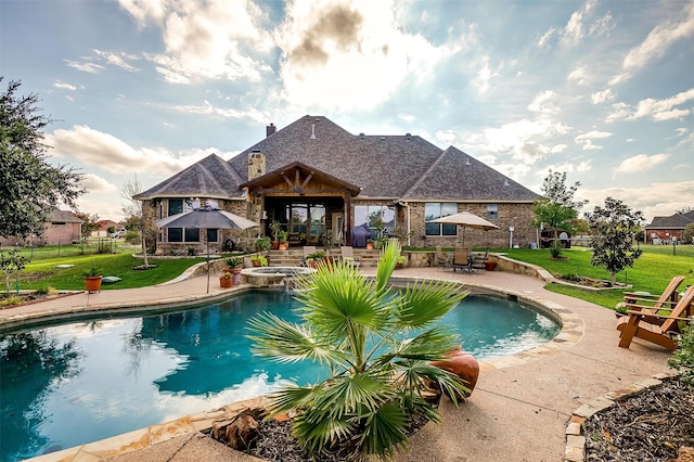 view of swimming pool featuring an in ground hot tub, a patio area, a gazebo, and a yard