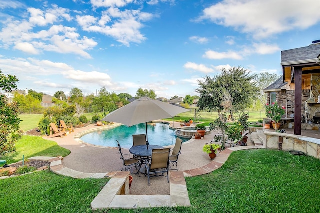 view of swimming pool with a lawn and a patio area