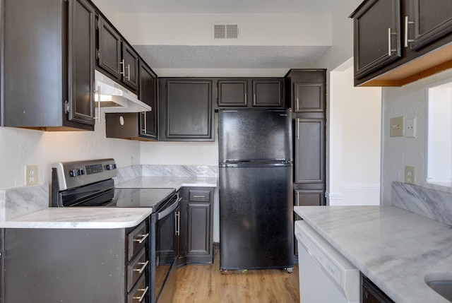 kitchen with dishwasher, light hardwood / wood-style floors, fridge, electric stove, and a textured ceiling