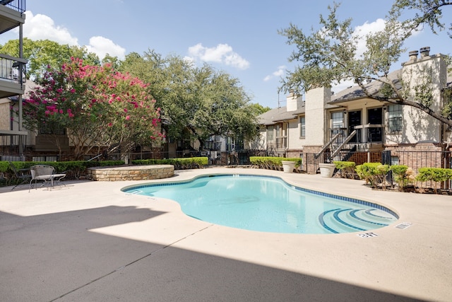 view of swimming pool with a patio