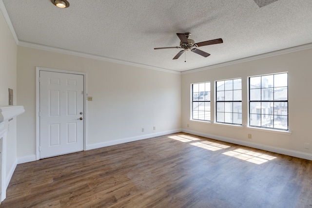 interior space with ornamental molding, ceiling fan, dark wood-type flooring, and a textured ceiling