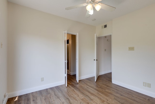 unfurnished bedroom with ceiling fan and light hardwood / wood-style floors