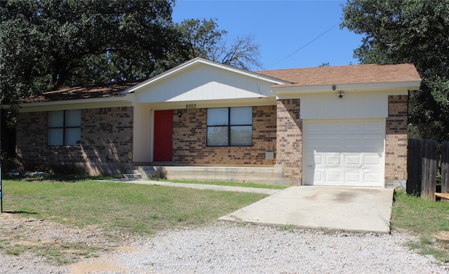 ranch-style home with a garage and a front lawn