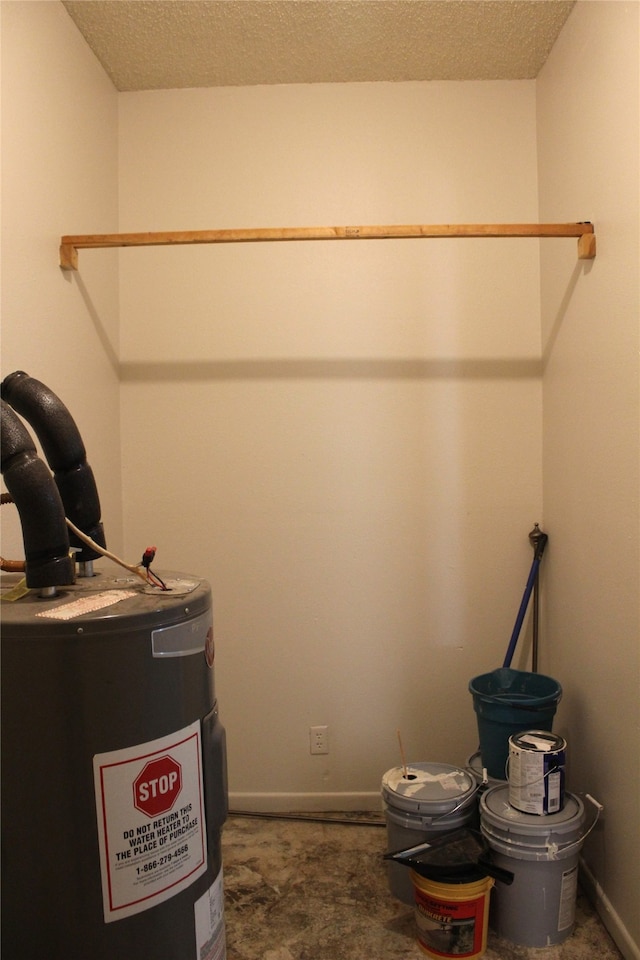 utility room featuring water heater