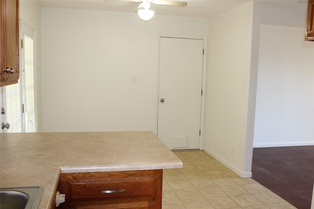 kitchen featuring ceiling fan