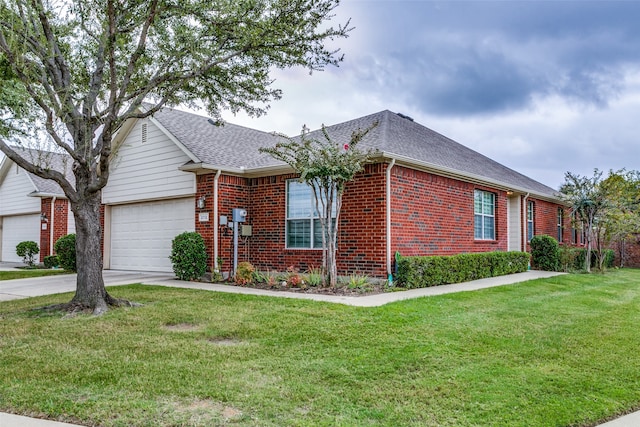 ranch-style house featuring a garage and a front lawn