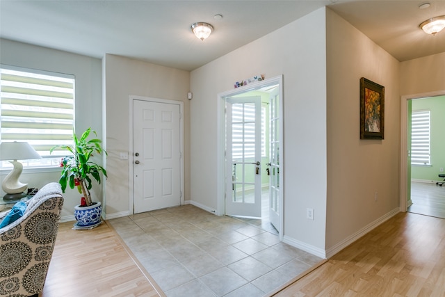 entrance foyer featuring light hardwood / wood-style flooring and a healthy amount of sunlight