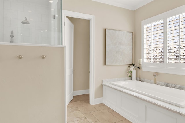 bathroom featuring ornamental molding and shower with separate bathtub