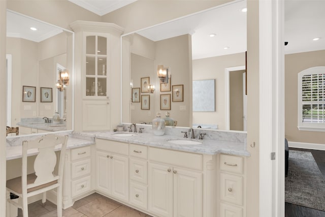 bathroom with ornamental molding, tile patterned floors, and vanity