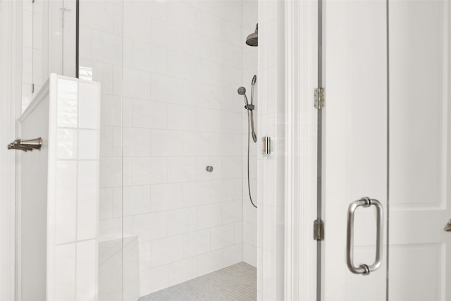 bathroom featuring a shower with door