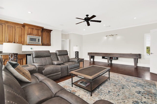 living room with ornamental molding, ceiling fan, and hardwood / wood-style floors