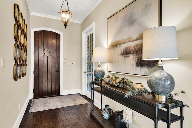 foyer entrance featuring wood-type flooring and ornamental molding