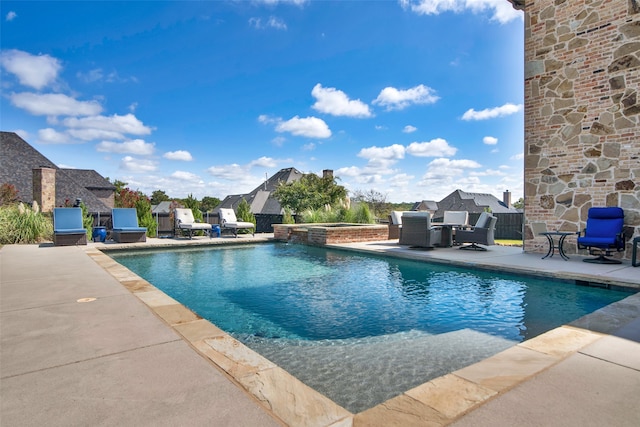 view of pool featuring an in ground hot tub and a patio