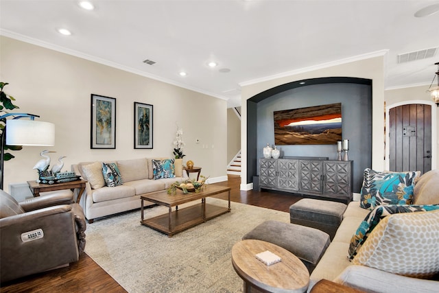 living room featuring ornamental molding and dark hardwood / wood-style flooring