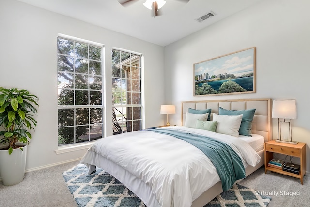 carpeted bedroom with ceiling fan