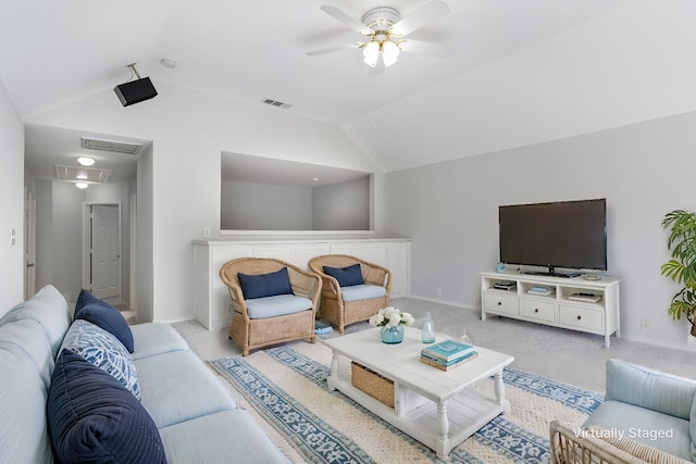 carpeted living room featuring vaulted ceiling and ceiling fan